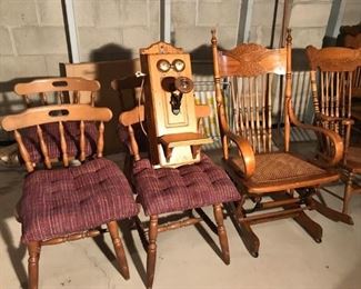 More unique oak chairs with an antique wall phone