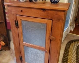 Small cabinet with punched tins