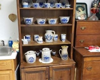 Pine cabinet with reproduction salt glazed pottery