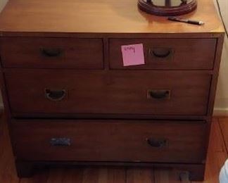 Four drawer dresser with metal lamp