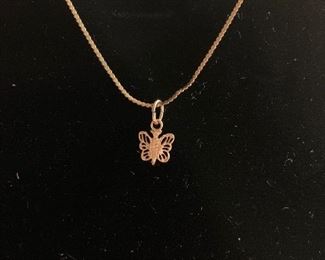 gold chain and butterfly