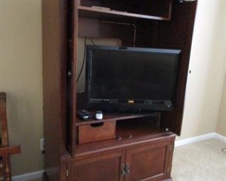 Traditional Entertainment Center Cabinet.. for TV., Could be used for books, wet bar or Bedroom Stg. Cabinet... Beautiful Walnut Wood... Excellent Condition.