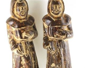 2 metal monk statues