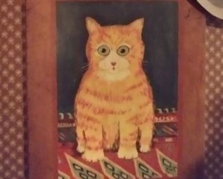Orange tabby cat painted on an old breadboard