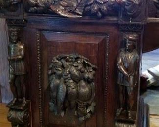 Wonderful, heavily carved English sideboard purchased in the South of England. Dogs, people, birds, fruit, this wonderful piece has it all 