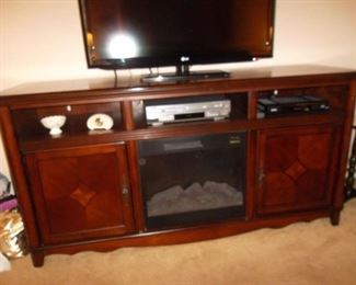 TV cabinet with electric fireplace heatolator