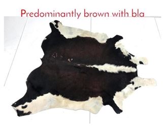 Lot 873 Natural Fur Cowhide. Predominantly brown with bla