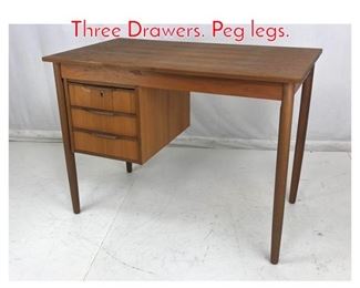 Lot 1008 Danish Teak Modern Desk. Three Drawers. Peg legs.