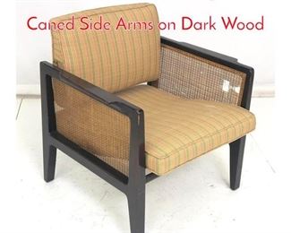 Lot 1044 DUNBAR Lounge Chair. Caned Side Arms on Dark Wood