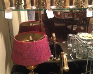 Small brass lamp with red shade