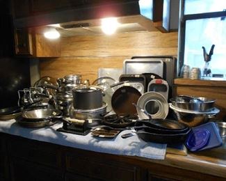 cast iron skillets, pots and pans, mixing bowl, etc.
