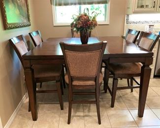 Lovely Pub Height Dining Table with Hidden Leaf Extended, Six Chairs. 5' X 5' with Leaf