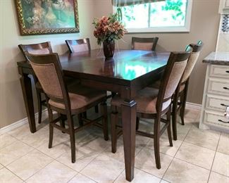 Lovely Pub Height Dining Table with Hidden Leaf Extended, Six Chairs. 5' X 5' with Leaf