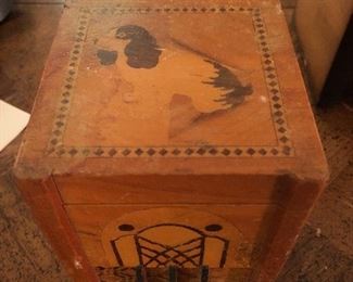 Inlaid wooden cigarette box with automatic cigarette dispensing feature
Dog brings cigarette up to you in its mouth