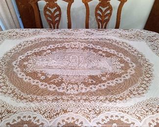 ONE OF THE ABSOLUTELY GORGEOUS LACE TABLE CLOTHS AVAILABLE AT THE SALE.  THIS ONE OF THE LORDS SUPPER LOVELY ON THIS DINING TABLE