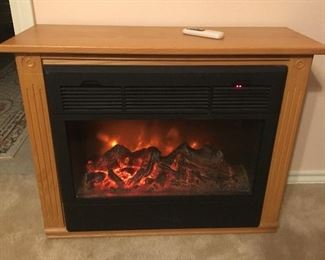 REMOTE CONTROLLED ILLUMINATED FIRE PLACE HEATER
