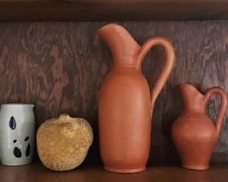 Springfield Pottery Works dog statue,  unmarked terracotta colored pitchers, Portmeirion Botanic Gardens canister, Williamsburg pottery mug, decor