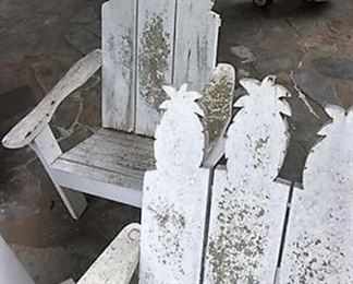 Outdoor wooden chairs with pineapple decor