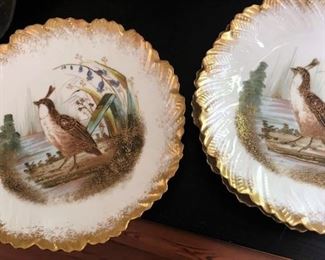Two of three gorgeous pheasant plates marked Limoges France
