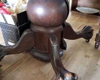 There is a round wonderful table on the top of this outstanding 'male' claw pedestal.