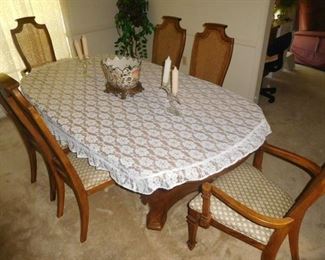 Dining table with 6 cane back chairs