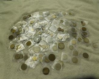 Hundreds of vintage foreign coins, some antique, some silver