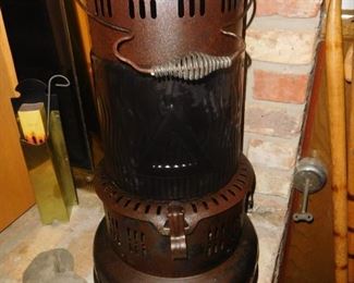 Perfection brand kerosene heater with glass middle