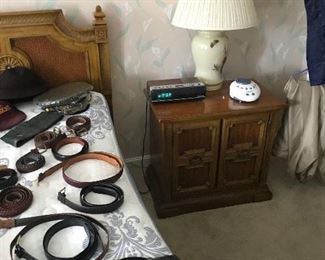 belts, night stands, lamp, alarm clock
