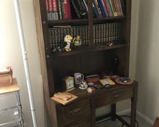 desk with hutch, tall lamp, books