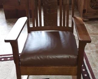 Antique Rocker with Leather Like Seat