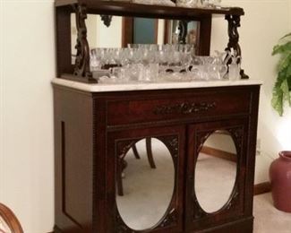 Beautiful antique walnut sideboard with oval 'petticoat' mirrors