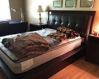 Very nice Queen size bed with faux leather headboard
