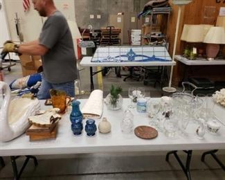 #1110: Approximately 50 miscellaneous estate items
Estate items include ceramic planter, brass clock, picture, salt and pepper shakers, vases, ceramic hot pad, different glasses, coffee mugs and more. Please view all photos