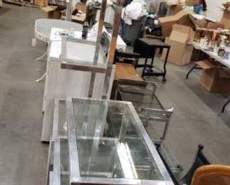 #1530: 2 Metal with Glass Shelved Stands
2 Metal with Glass Shelved Stands, 1- 80" Tall and 1- 37" Tall