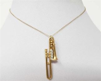 #169: 14k Gold Necklace with Gold and Diamond Trumpet Pendent, 2.4g
Weighs approx 2.4g, Chain is knotted