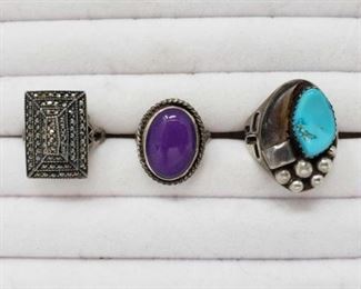 #21: Three .925 Sterling Silver Rings 26.3g
Three .925 Sterling Silver rings weighing approx. 26.3g all together. Ring with turquoise size 9.5 Ring with purple gem size 8 Studded silver ring size 9