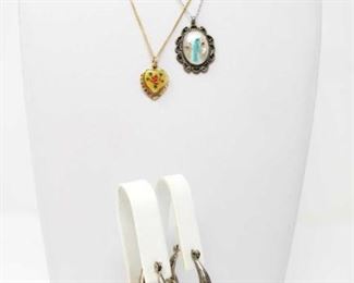 #179: Two Sterling Silver Necklaces and Pair of Earrings
Gold-colored chain is not sterling, only pendent Silver combined weighs approx 17.2g Chains measure approx 16" and 18"