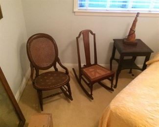 Victorian rocker has caned seat underneath