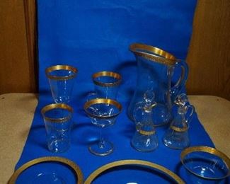 Tiffin gold rim crystal set with pitches, champagne glass, tumbler, cup, water glass, bowls and cruets (representative service)
