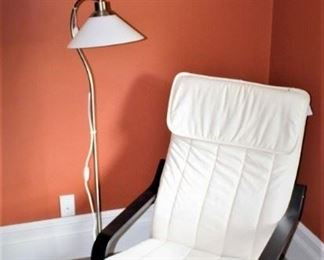 Sling back chair and floor lamp.  