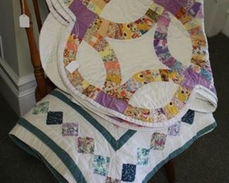 Quilts on chair.
