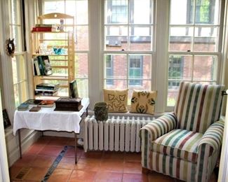 Coffee/library size books, Arts and Craft hand embroidered pillows and striped chair.  
