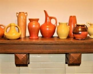 The mantel is full of great pieces of vintage pottery.  