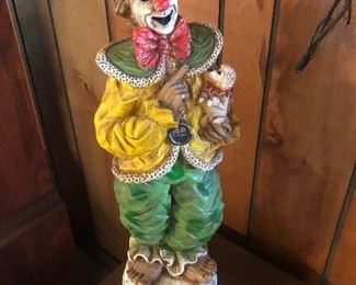 Clown statue with tiny poodle