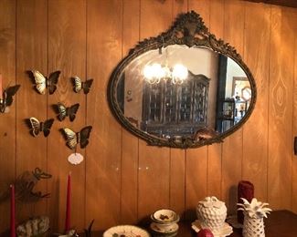 Victorian oval mirror.  Brass butterfly decor