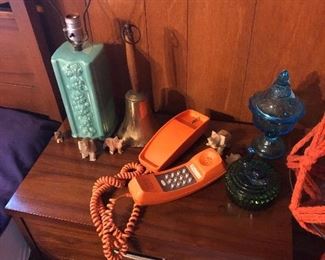 MCM nite stand.  Orange phone, depression glass candy dishes, teal lamp