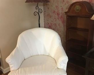 Swivel chair with cotton slip cover.