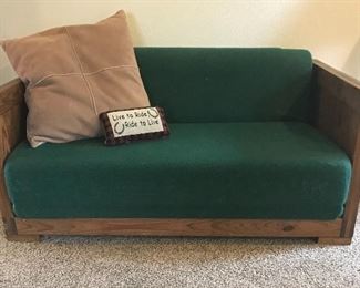Small pinewood love seat - folds out into a bed