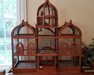 Antique wooden bird house with copper bottom tray
