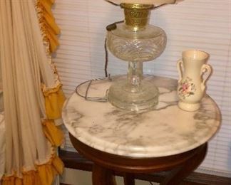 Antique marble top table with Aladdin Lamp and hand painted daisy shade